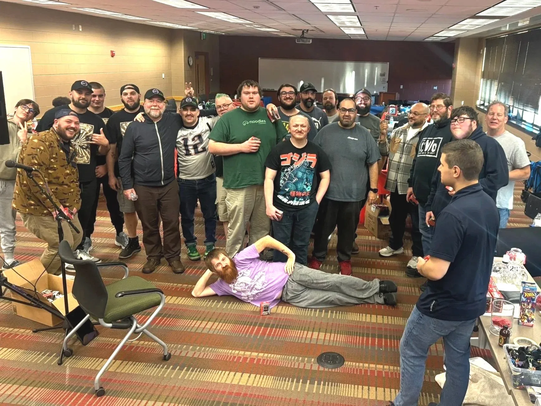 A large group of Red, White, and Clix attendees posing together at the end of an event.